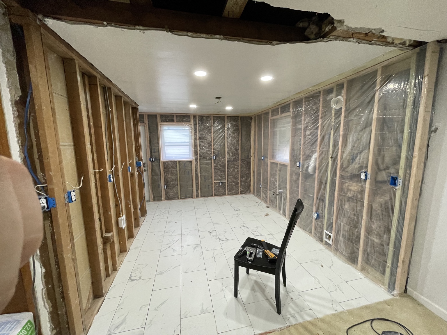 Interior renovation framing and insulation in progress