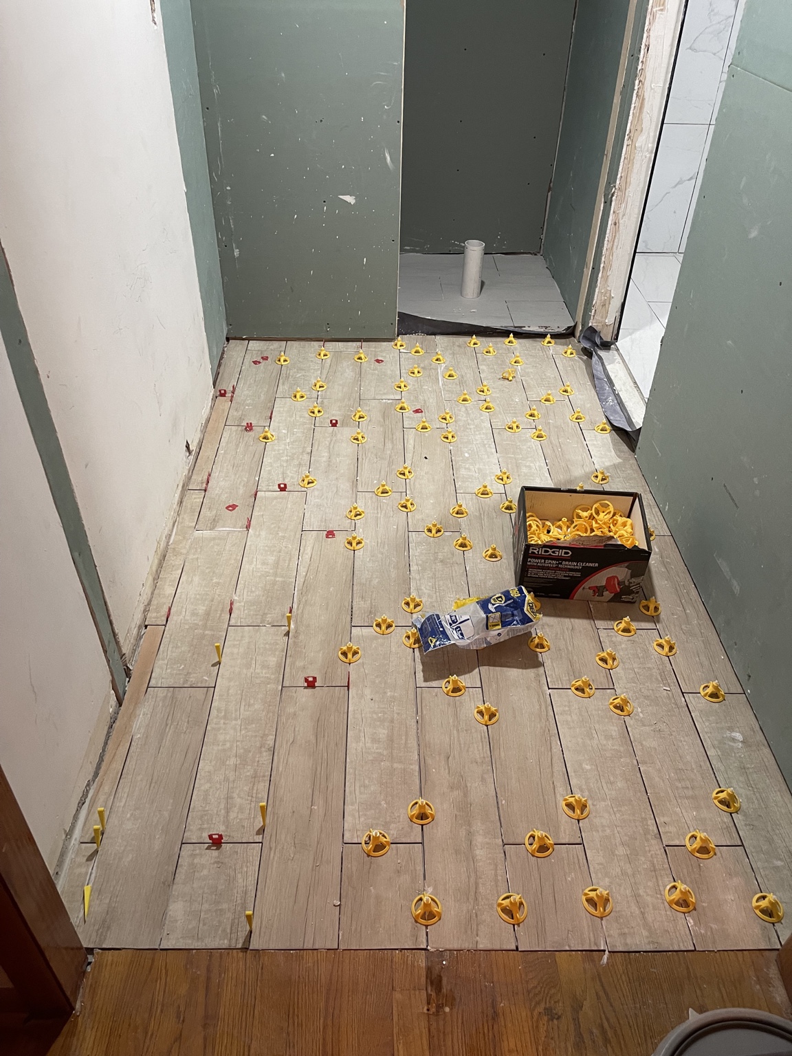Bathroom tile installation in progress